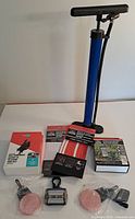 Group shot showing pump, phone mount box, three reflective strip packs, LED light, two round reflectors