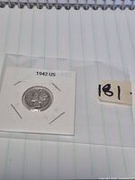 Obverse of 1942 Mercury Dime in labelled 2x2 flip