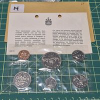 Full view of six coins in sealed strip with RCM card