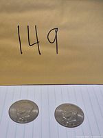 Both Eisenhower dollar coins side by side
