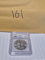 Front of encapsulated 1973-S Eisenhower dollar showing obverse and ICG label