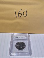 Front view of ICG-slabbed 2005-D Kennedy half dollar