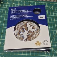 Front of sealed keepsake card showing title, Riopelle artwork, mintage note