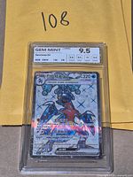 Front view of encapsulated NXR graded Garchomp ex card showing grade label Gem Mint 9.5 and card artwork