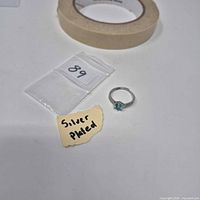 Ring with label "silver plated" and size bag