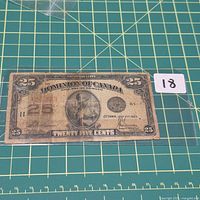 Front of 1923 Dominion of Canada 25-cent note showing design and wear