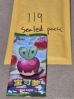 Front of sealed booster pack with Applin artwork