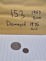 Overview of both damaged coins with handwritten identifiers