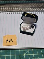 Pendant in presentation box on notebook