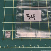 Bar beside labelled bag on measurement mat