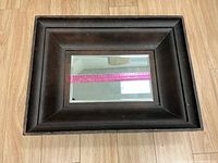 Front view showing entire mirror and wooden frame