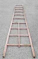 Full view of entire ladder laid flat on pavement