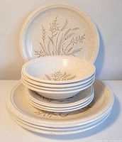 Stacked plates and bowls showing quantity and pattern