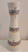 Full view of vase front showing texture and band design