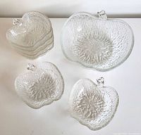 Overhead view showing one large bowl, six small bowls