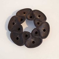 Top view showing 12 candle holes in lotus petal design
