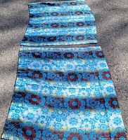 Full view of both curtain panels laid flat showing pattern and size relation