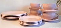 Group shot of all 16 pink J&G Meakin Hotelbilt pieces
