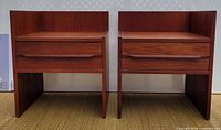 Front view of both teak bedside tables showing drawers and overall design