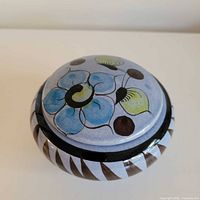 Top view showing floral decoration on lid