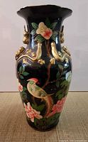 Full view of vase front showing painted bird and flowers