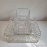 Large and small ribbed dishes stacked