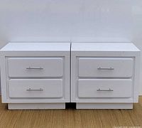front view of both nightstands showing drawer fronts and handles