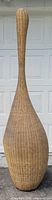 Full view of tall elongated wicker lamp shade