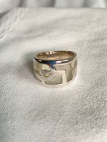 Front view of sterling silver cutaway band ring