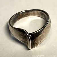 side view of sterling silver ring showing sculpted ridge design