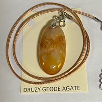 Pendant necklace on display card showing overall appearance