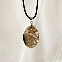 Front view of agate pendant on cord