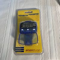 Front view of sealed Sportline electronic pedometer in packaging