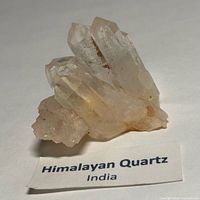 Front view of quartz cluster on label identifying origin