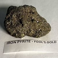 Front view showing metallic luster and crystal flecks