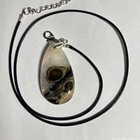 Pendant on cord showing overall design