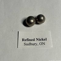 Two nickel spheres on label identifying source