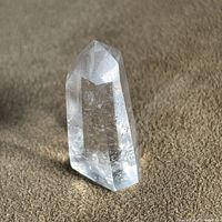 upright view of clear quartz point showing overall shape and clarity