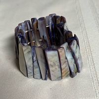 Full view of bracelet standing upright showing shell pieces