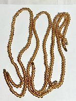 Full view of single-strand glass bead necklaces