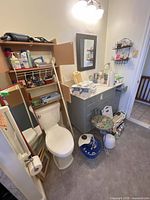 Overview of bathroom vanity, toiletries, foot spa, scales and grooming items