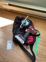 Power unit with circular saw attachment, battery, and carrying bag