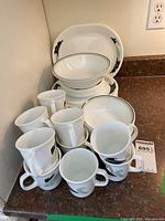 Full grouping of mugs, plates, bowls and platter