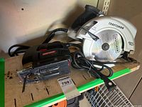 Circular saw and sabre saw side by side on shelf