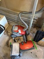 Complete lot showing vacuum body, hose, wand, heads, and bag package