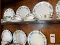 Cabinet shelf showing plates, bowls, cups and saucers in Bristol pattern