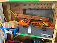 Overall view of Benchmaster toolbox, wooden level, socket set tray, basket with gloves