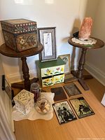 Group shot showing both pedestal tables, salt lamp, decorative boxes, organizer, framed art, jars, plaques