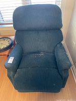 Front view of La-Z-Boy recliner showing overall design and wear