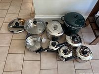 Group shot of entire cookware set on floor